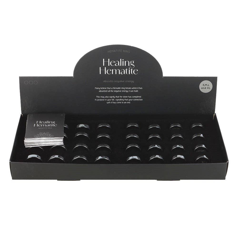 Set of 32 Healing Hematite Rings in Display